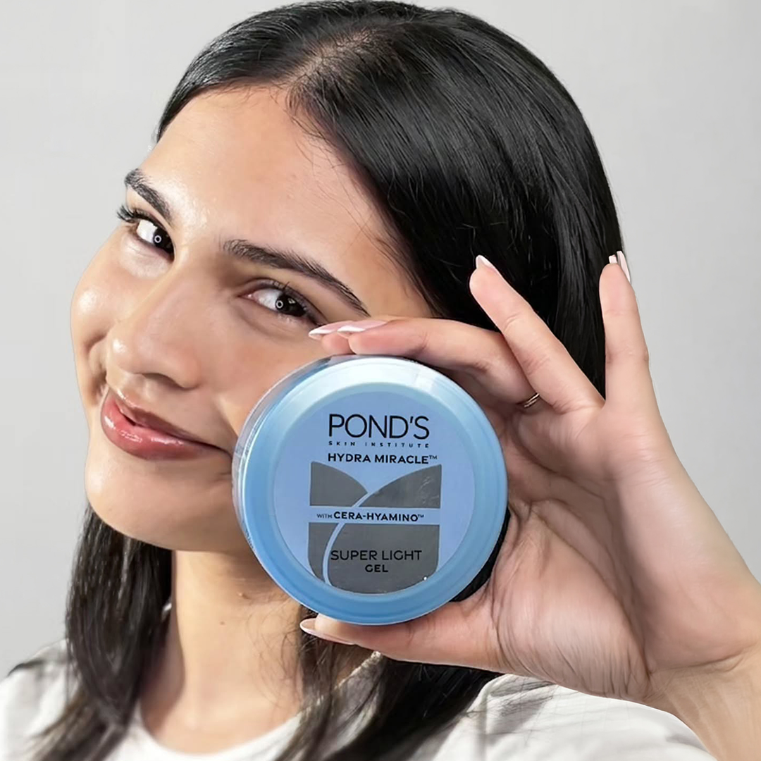 Girl Holding Non-Sticky Moisturiser