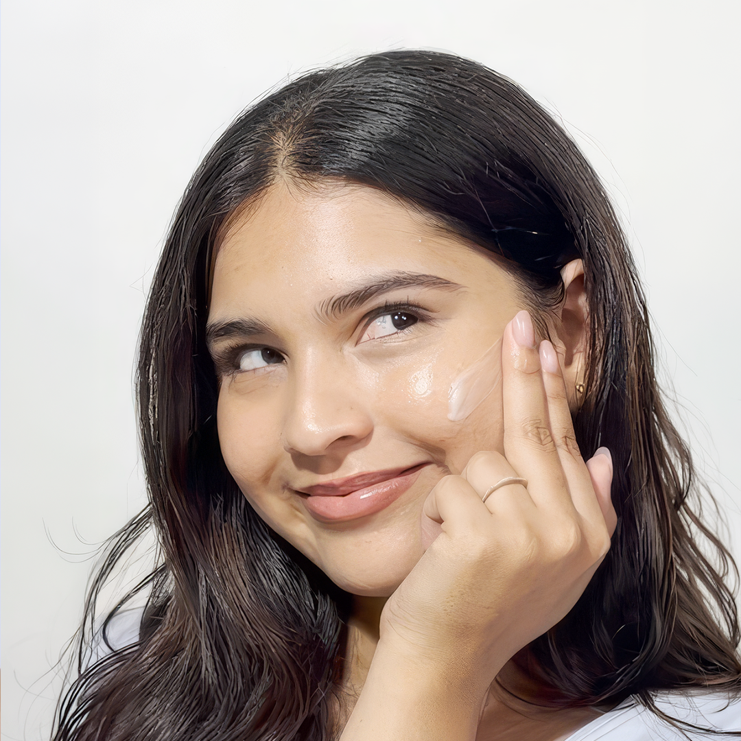 Woman Applying Moisturiser on Face